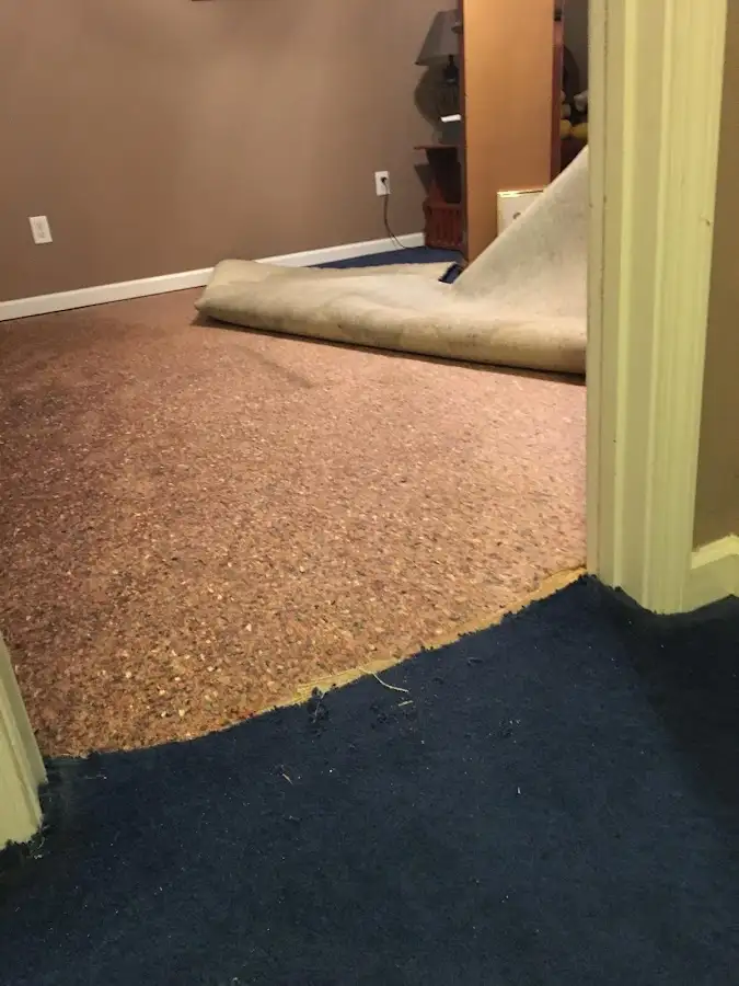 Carpet pad removal revealing water damage during Drying & Dehumidification in Yucca Valley